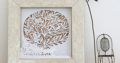 Paper-cut winter woodland scene